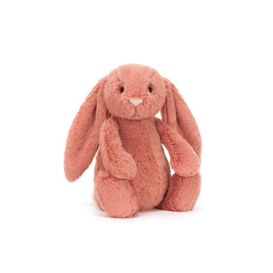 Un doudou lapin rose argile Jellycat, vue de face sur fond blanc