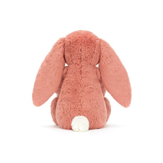 Un doudou lapin rose argile Jellycat, vue de derrière sur fond blanc